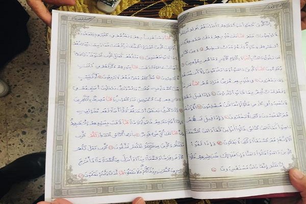 تجلیل از دانش‌آموز مصری که کل قرآن را کتابت کرده است + عکس